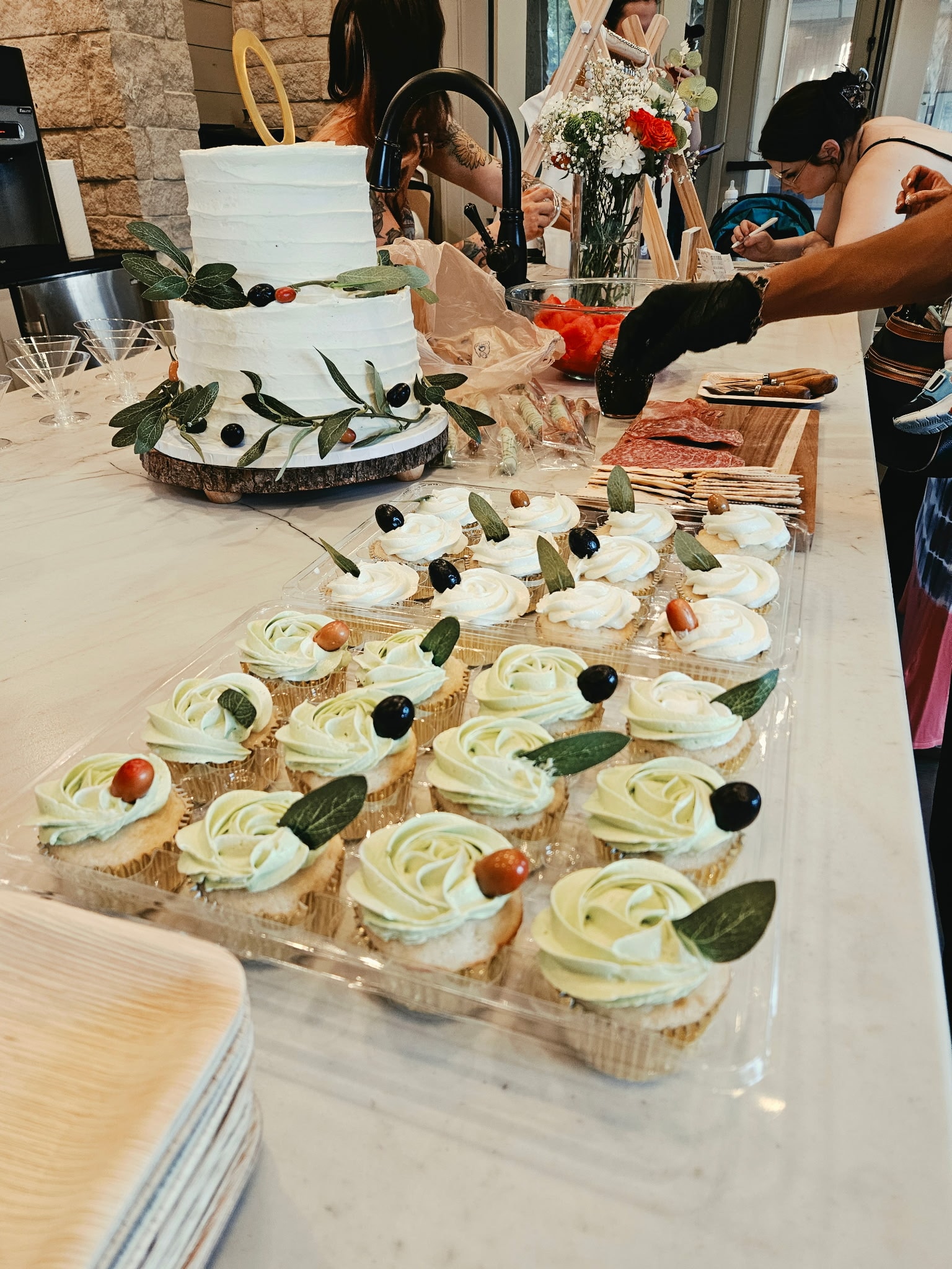 Baby shower cake and cupcakes with olive branch decoration