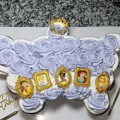 Princess pull-apart cupcake cake with lavender rosettes and Disney princess portraits