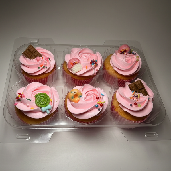 Pink frosted cupcakes with colorful candy toppings